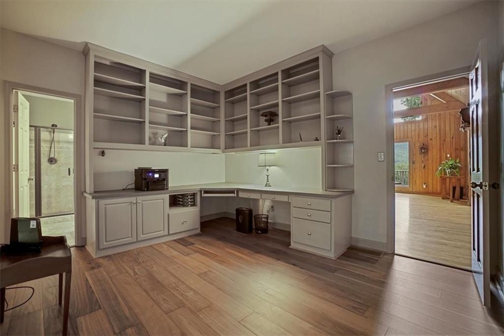 188 Tea Berry Lane Jasper, GA 30143 - Photo 10 of 68 a kitchen with granite countertop white cabinets and white appliances