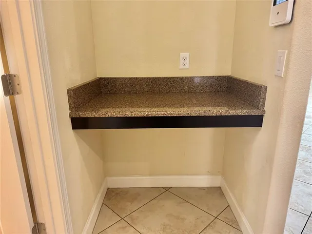 a spacious bathroom with a tub sink and mirror