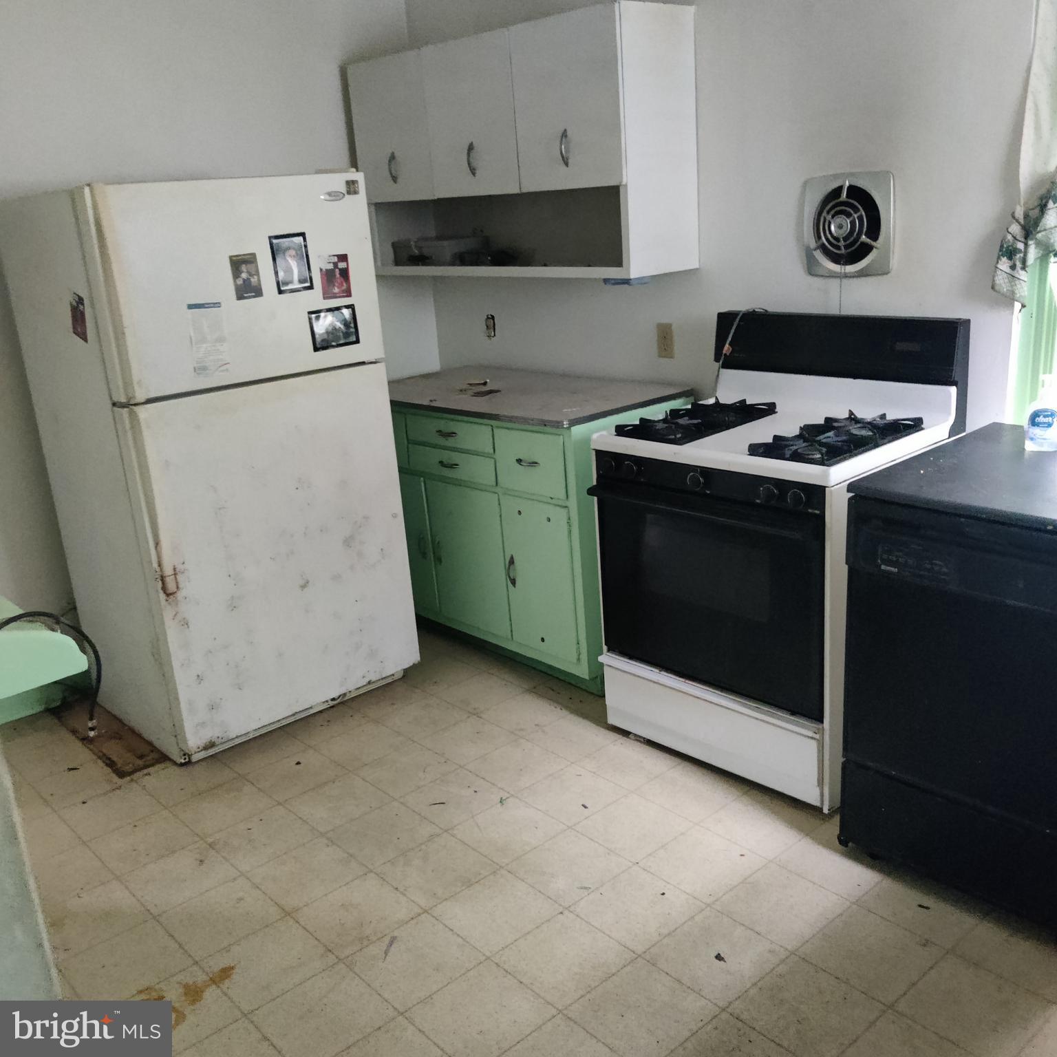 209 Sharpless Street West Chester, PA 19382 - Photo 4 of 12 a kitchen with a stove and a refrigerator