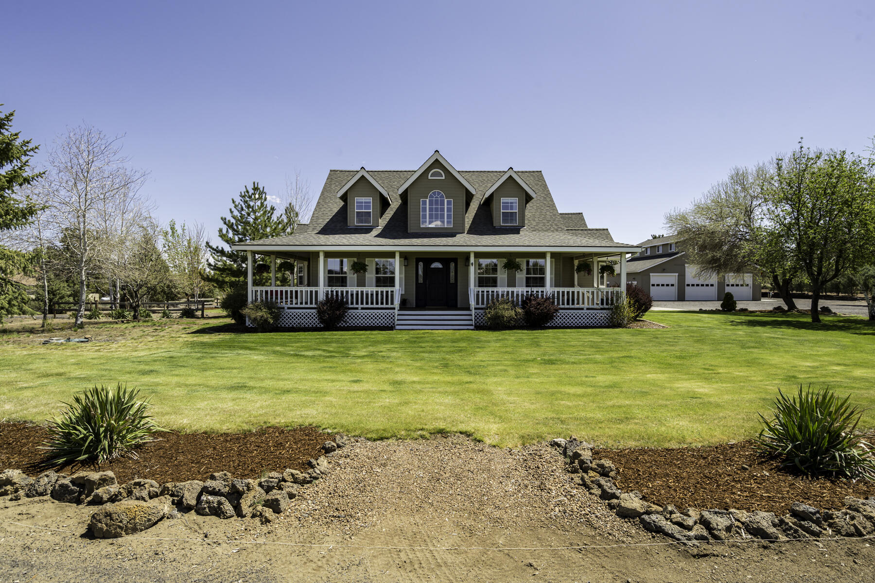 61030 Jennings Road Bend, OR 97702 - Photo 2 of 76 a view of a house with swimming pool next to a yard