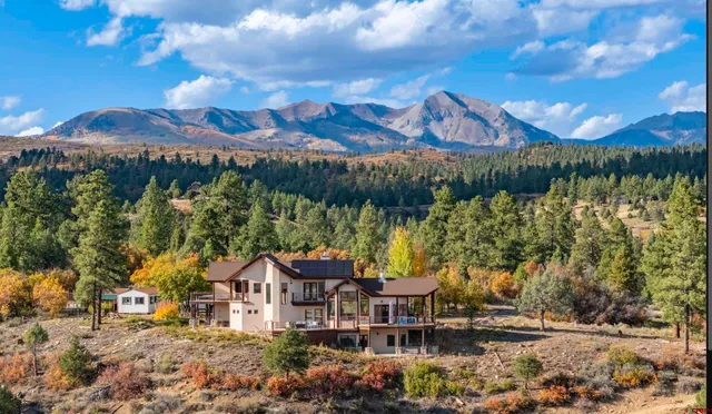 a view of a chairs and table in patio