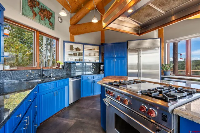 a kitchen with a stove and a sink
