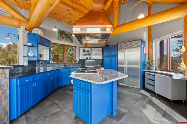 a kitchen with a stove and a refrigerator