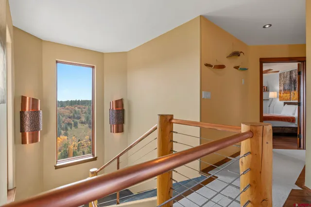 a view of a living room with furniture and a window