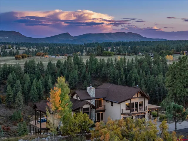 a view of a house with a lake view
