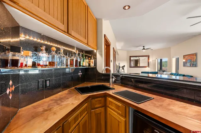 a kitchen with stainless steel appliances granite countertop a sink and cabinets