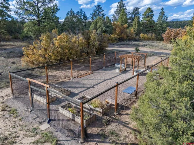 a view of a backyard with sitting area