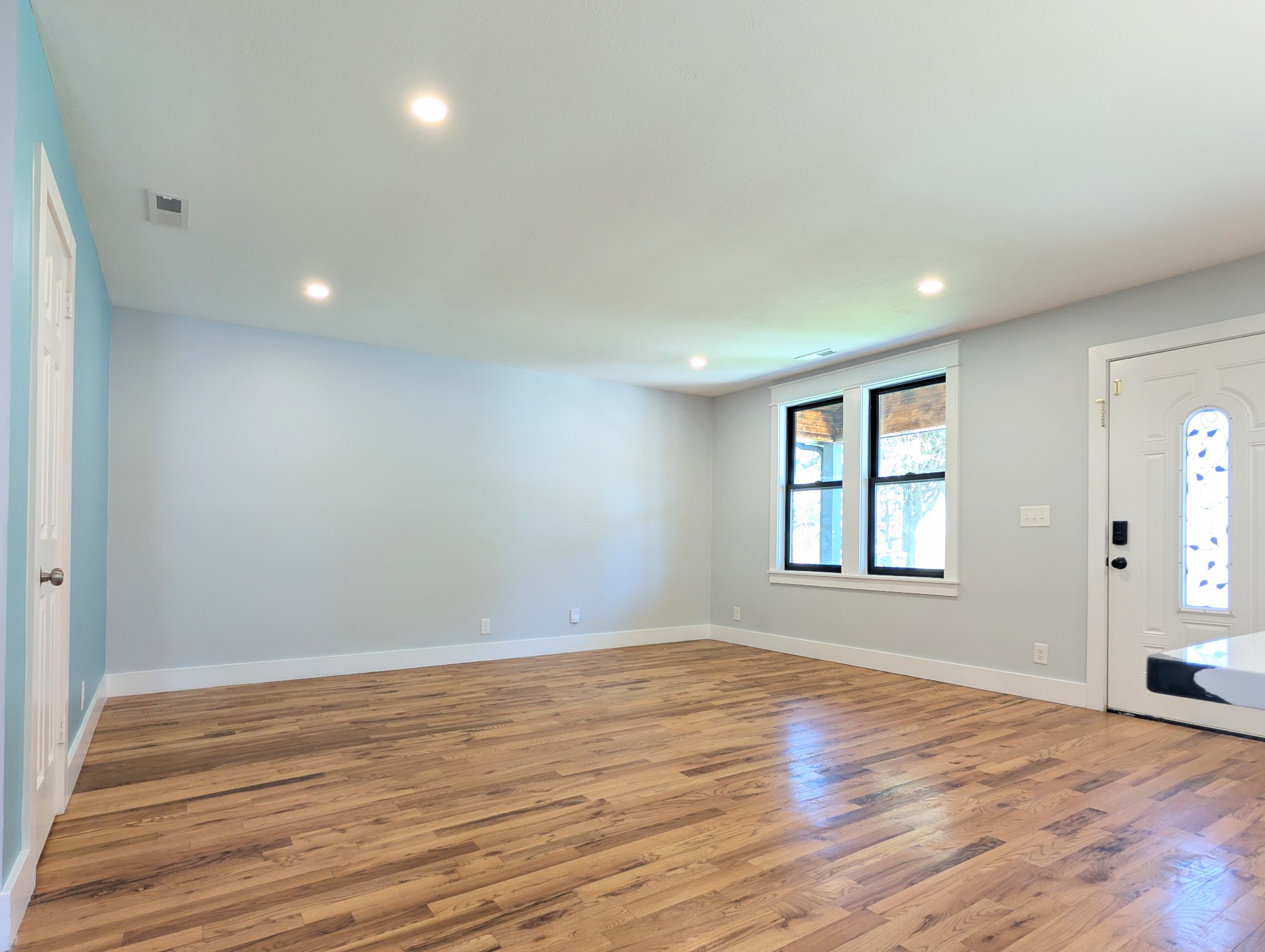 244 Warrior Road Madison, TN 37115 - Photo 8 of 24 wooden floor in an empty room with a window