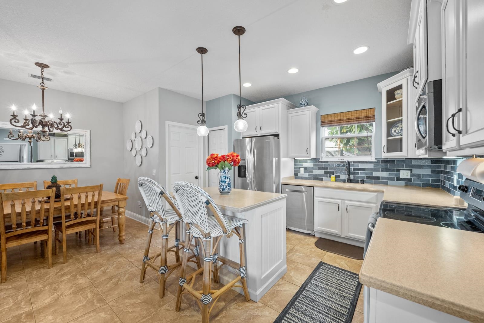 120 Menendez Road, Unit A St. Augustine, FL 32080 - Photo 11 of 50 a kitchen that has a table and chairs in it