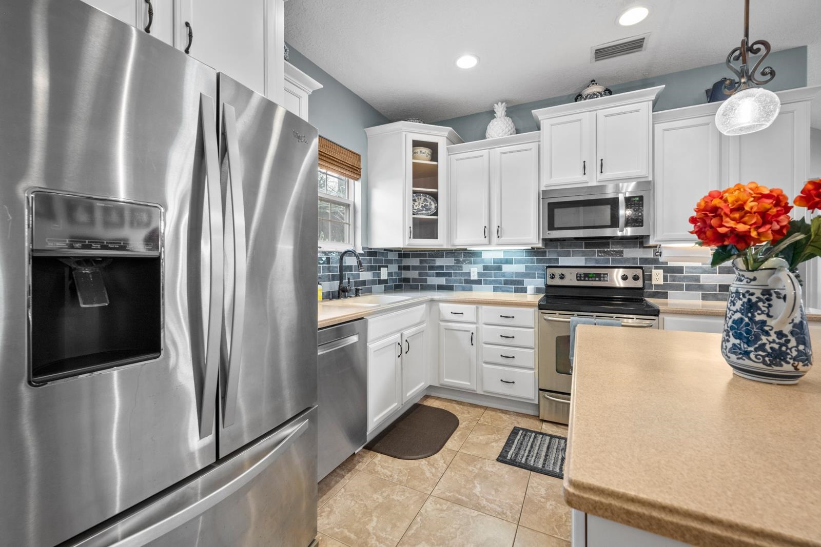 120 Menendez Road, Unit A St. Augustine, FL 32080 - Photo 14 of 50 a kitchen with stainless steel appliances a refrigerator sink and microwave