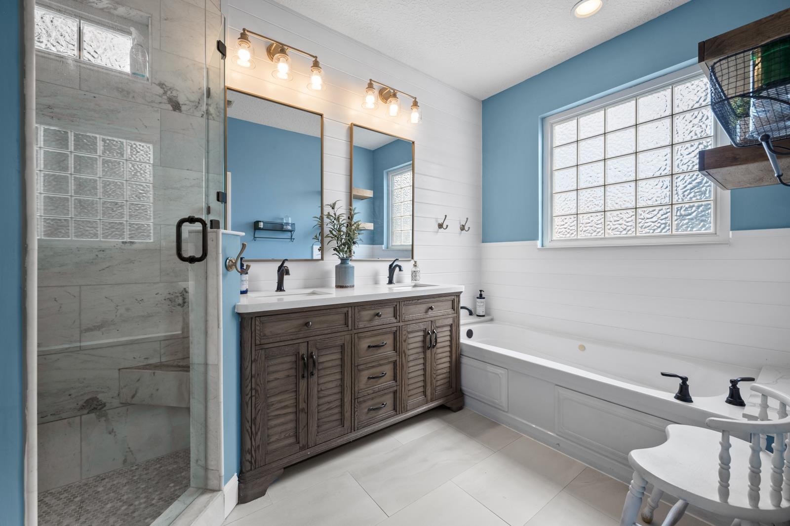 120 Menendez Road, Unit A St. Augustine, FL 32080 - Photo 19 of 50 a bathroom with a double vanity sink mirror and bathtub