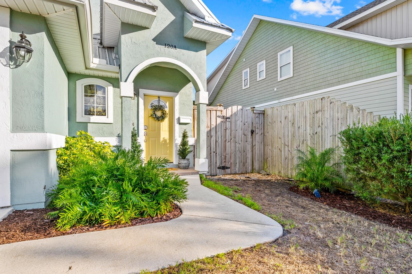 120 Menendez Road, Unit A St. Augustine, FL 32080 - Photo 2 of 50 a front view of a house with garden