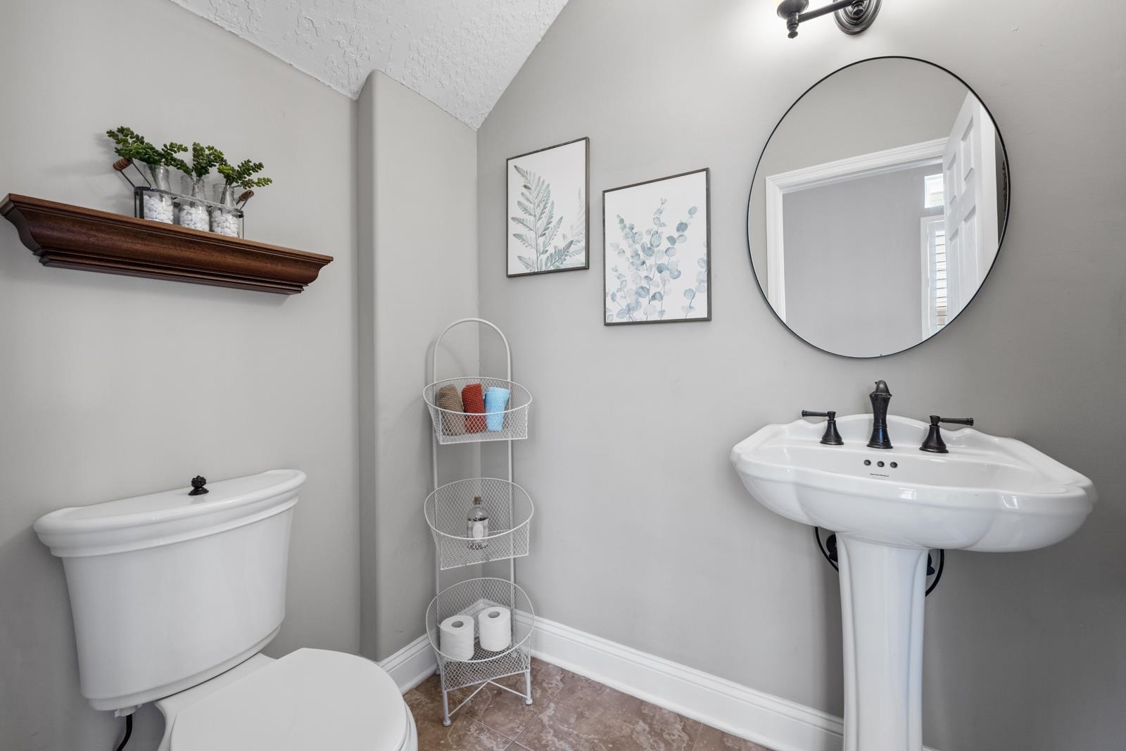 120 Menendez Road, Unit A St. Augustine, FL 32080 - Photo 21 of 50 a bathroom with a toilet sink and mirror