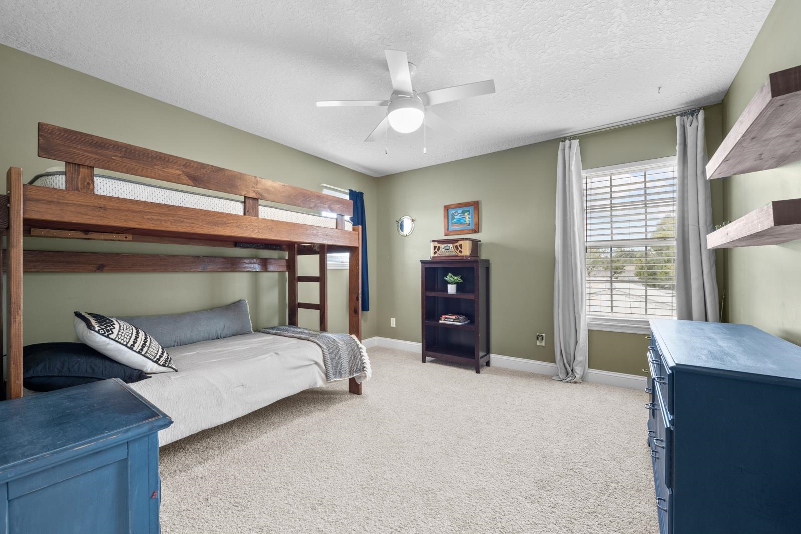120 Menendez Road, Unit A St. Augustine, FL 32080 - Photo 24 of 50 a bedroom with a bed and a large window
