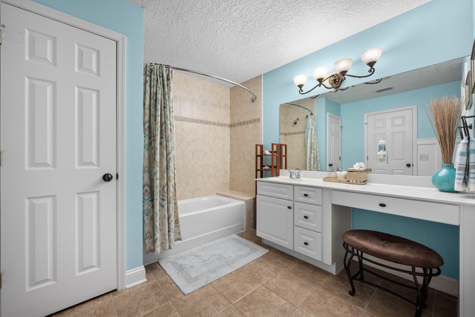 120 Menendez Road, Unit A St. Augustine, FL 32080 - Photo 27 of 50 a spacious bathroom with a double vanity sink a mirror a bathtub and a shower