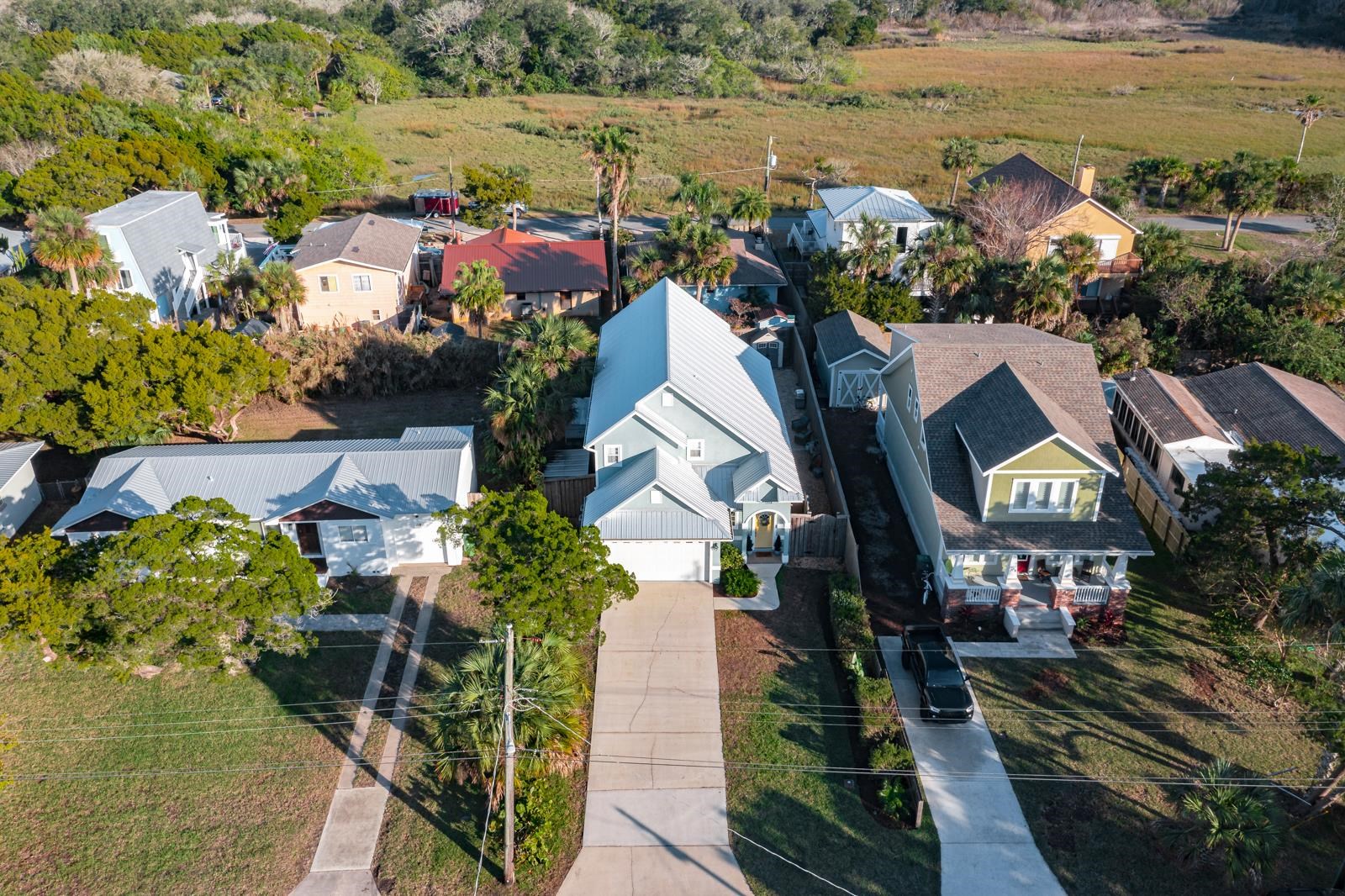 120 Menendez Road, Unit A St. Augustine, FL 32080 - Photo 49 of 50 a aerial view of a house with a yard and lake view