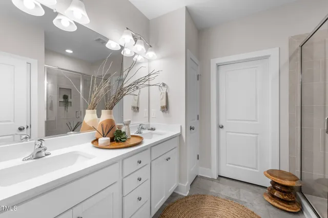 a bathroom with a sink a vanity and a mirror