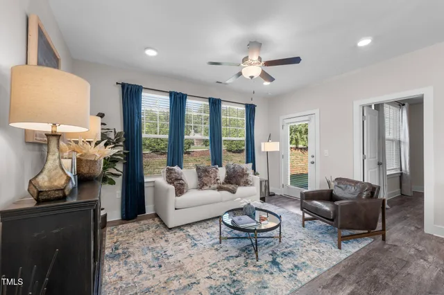 a living room with furniture and a large window