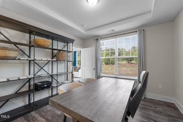 workspace with wooden floor and windows