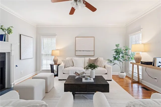 a living room with furniture and white walls