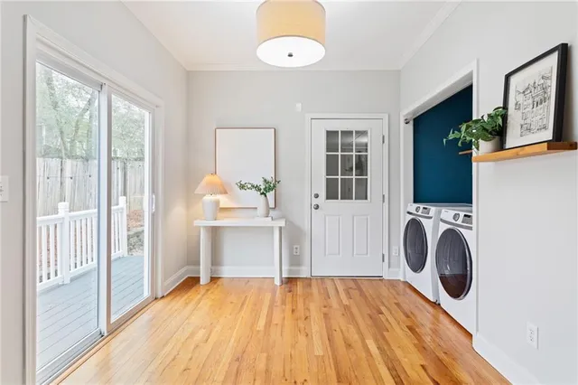 a view of a bedroom with a bed and wooden floor