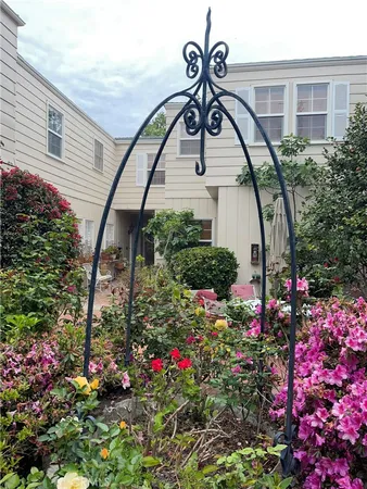 a backyard of a house with yard barbeque oven and outdoor seating