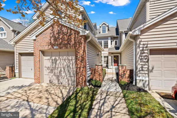 a view of a brick house with many windows