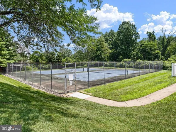 a view of a backyard with a swimming pool
