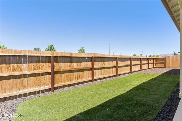 a view of outdoor space with deck and mountain view