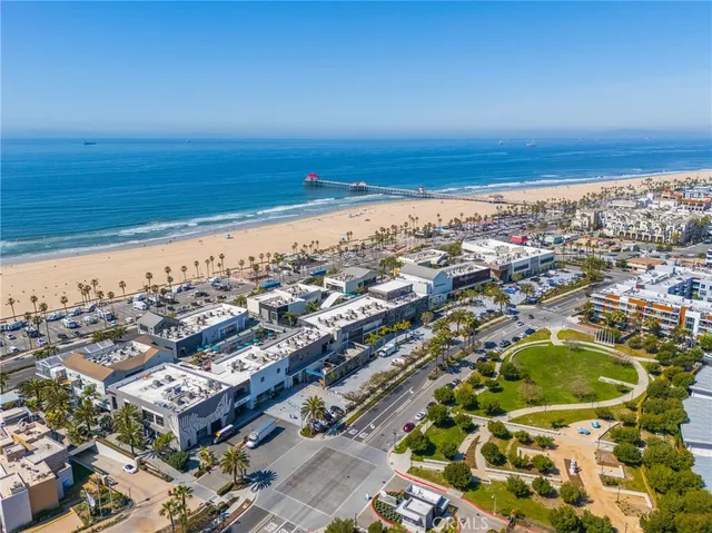 an aerial view of residential building and ocean