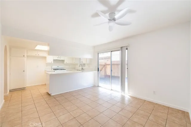 a view of a kitchen with marble kitchen and front door