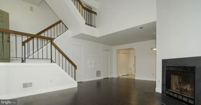 a view of an entryway with wooden floor