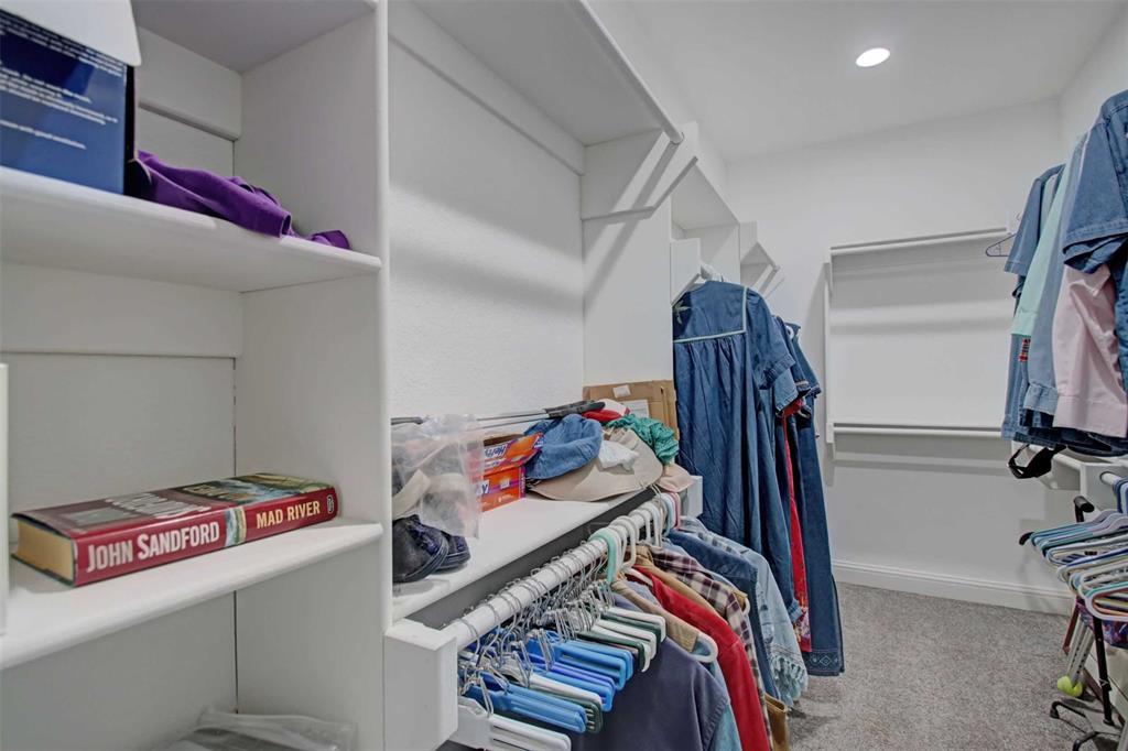 8789 Hutcheson Hill Road Springtown, TX 76082 - Photo 18 of 29 Walk in closet featuring light colored carpet