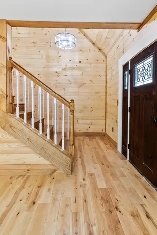 a view of entryway with wooden floor