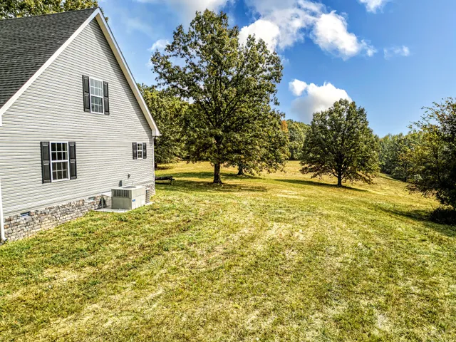 a view of a house with wooden walls