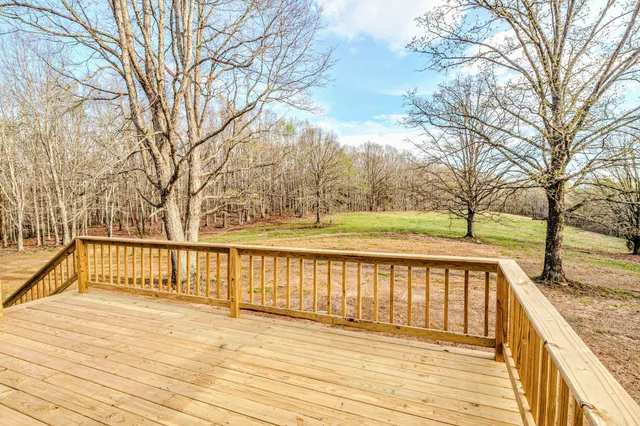 an aerial view of mountain with yard and green space