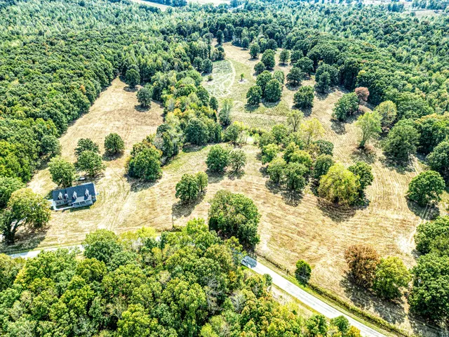 a view of house with yard and entertaining space