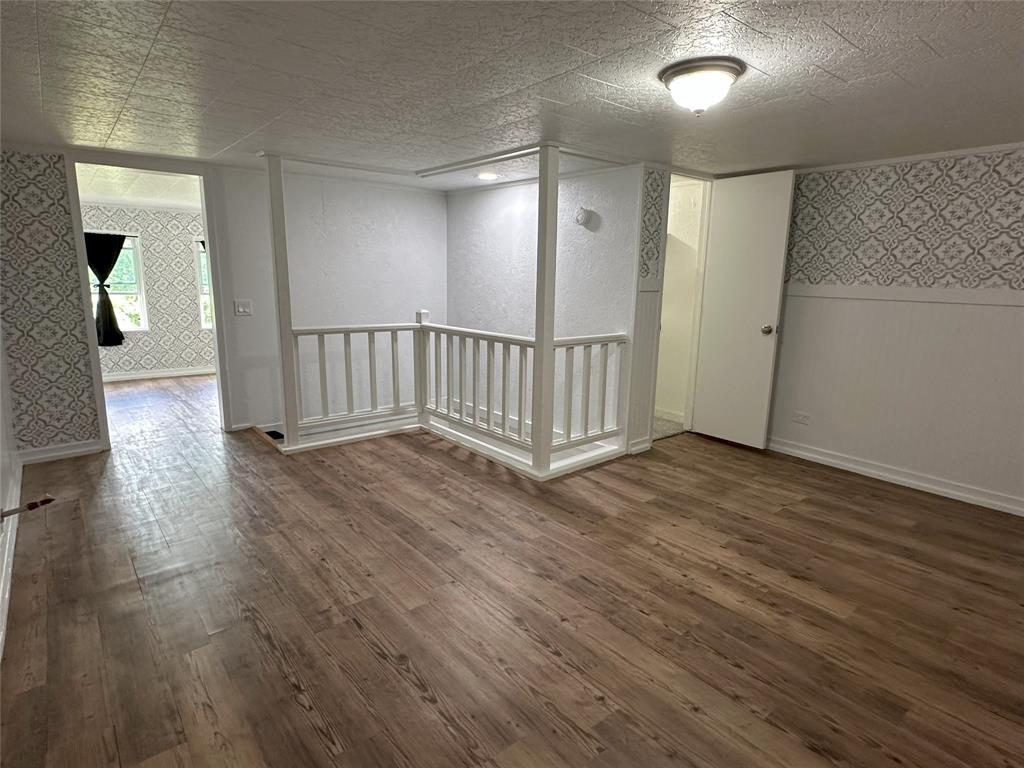 506 Northeast 3rd Street Hubbard, TX 76648 - Photo 14 of 17 wooden floor in an empty room