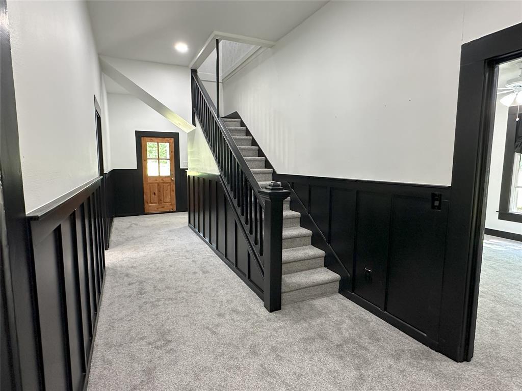 506 Northeast 3rd Street Hubbard, TX 76648 - Photo 5 of 17 a view of entryway and hall with wooden floor