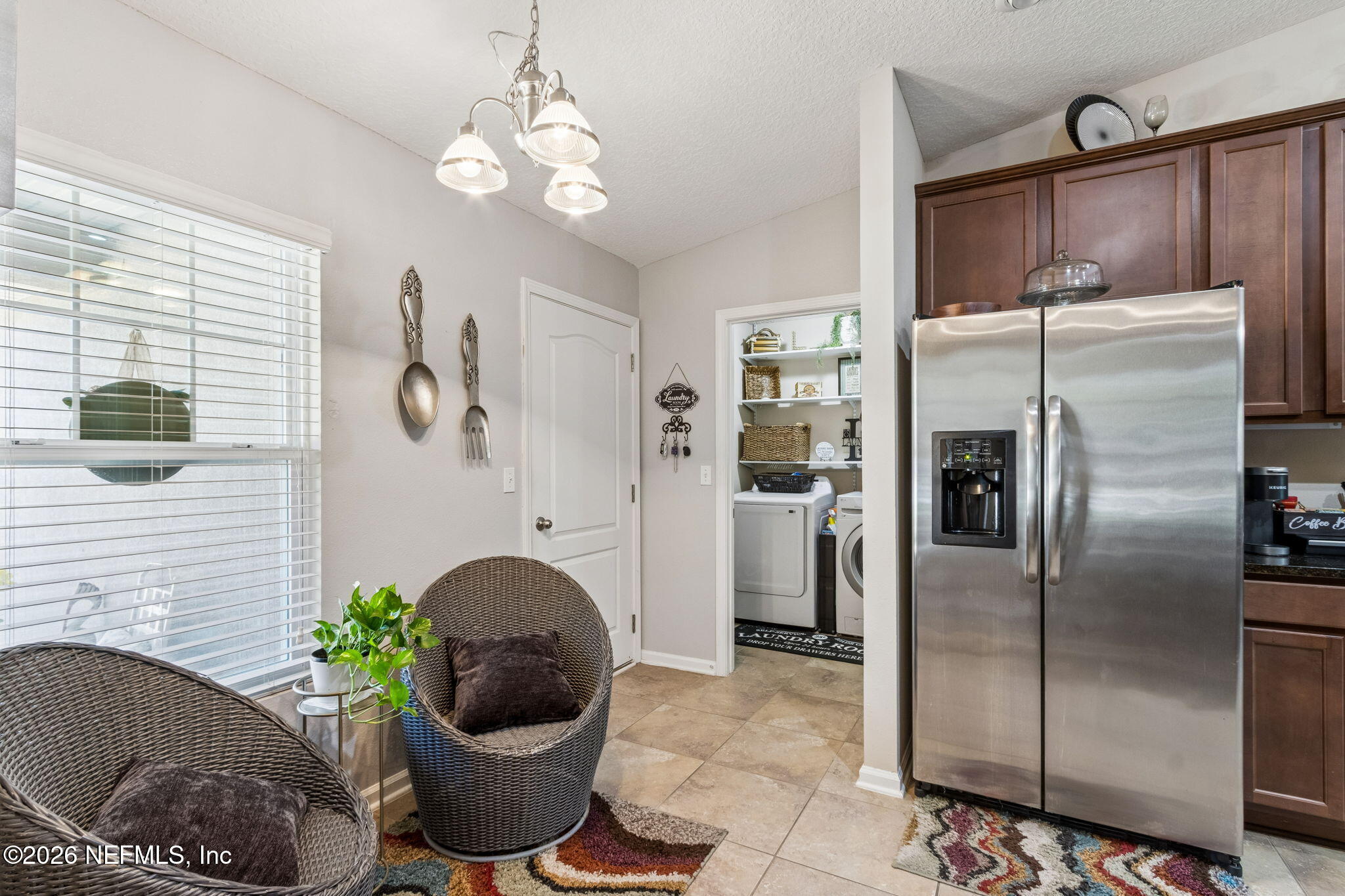 96034 Bass Lane Yulee, FL 32097 - Photo 22 of 50 a kitchen with a refrigerator and a potted plant