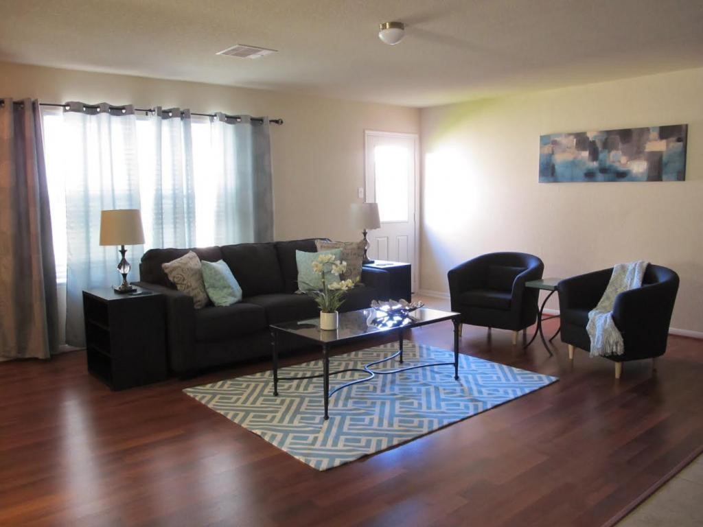 a living room with furniture and a window