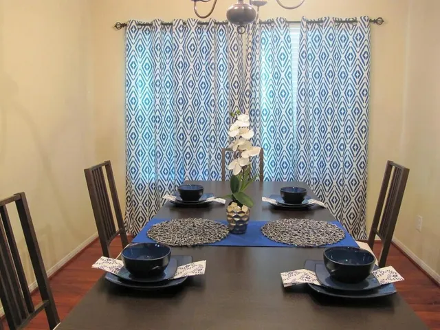 a table and chair with potted plant