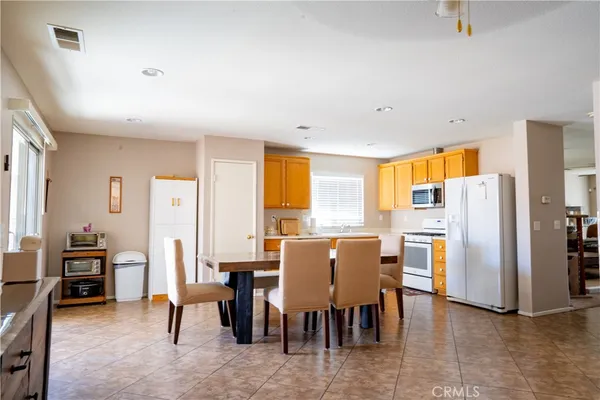 a view of a dining room with furniture window and outside view