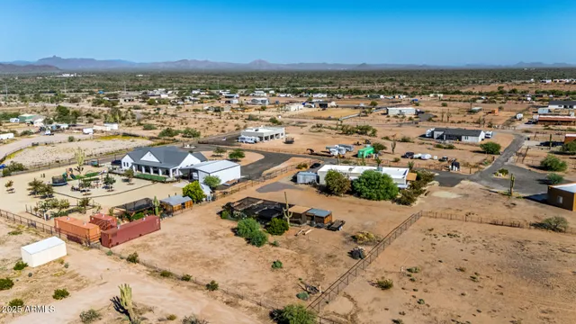 an aerial view of residential building and ocean
