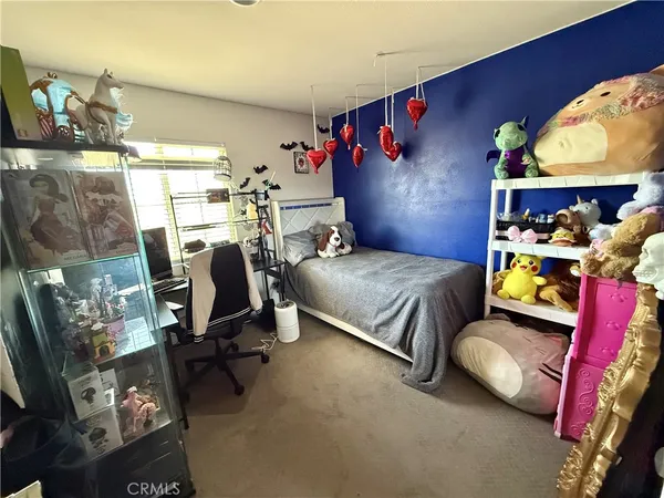 a bedroom with furniture and a bed