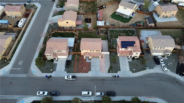 an aerial view of houses with outdoor space