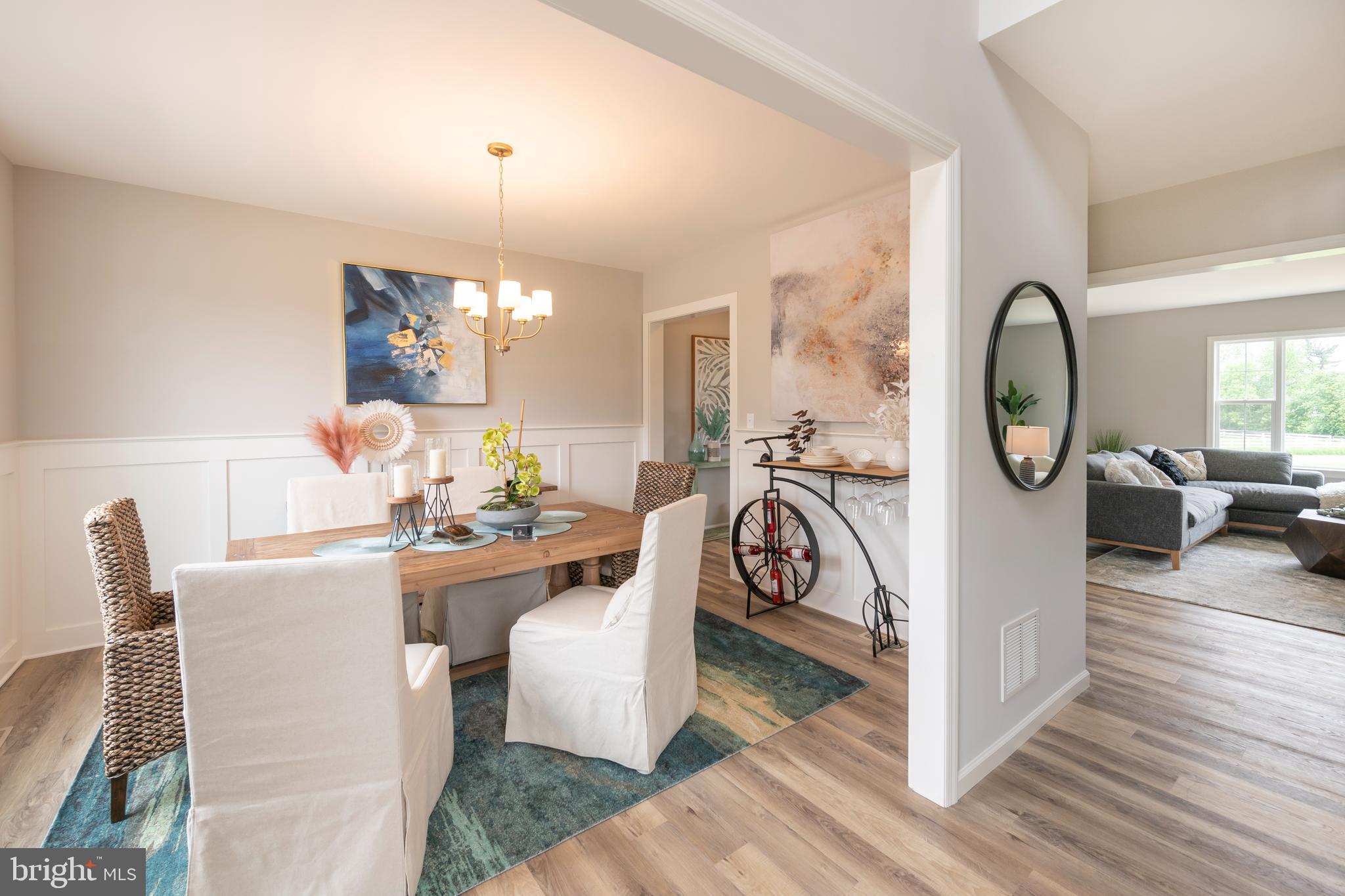 4 Old Orch Road Strasburg, PA 17579 - Photo 12 of 25 a view of a dining room with furniture chandelier and wooden floor
