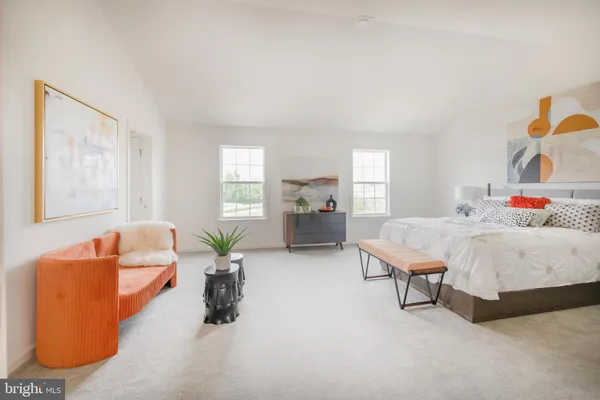 a bedroom with furniture and a couch