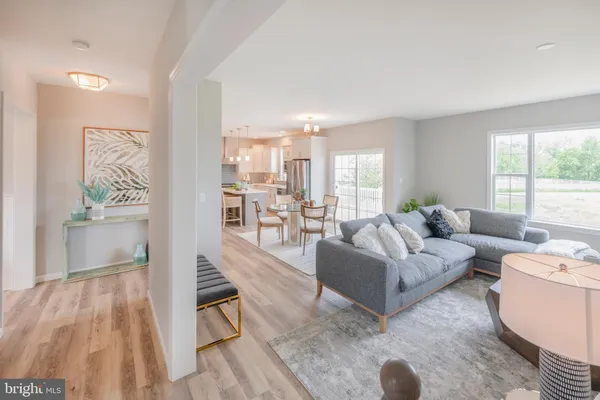 a living room with furniture and a table
