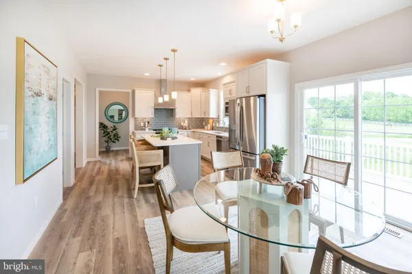 a view of a dining room with furniture window and outside view